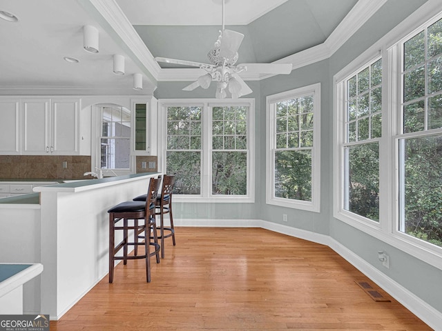 interior space with ceiling fan