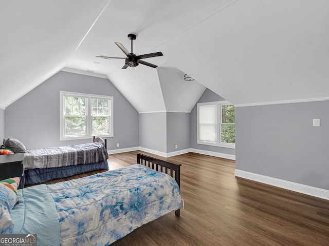 bedroom with lofted ceiling, dark hardwood / wood-style floors, and ceiling fan