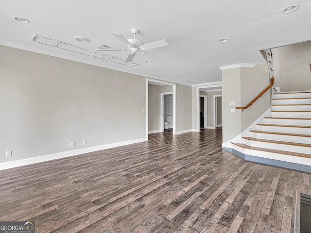 unfurnished living room featuring ceiling fan, dark wood-type flooring, and ornamental molding