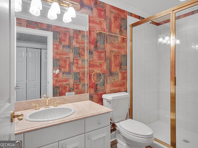 bathroom with an enclosed shower, crown molding, vanity with extensive cabinet space, and toilet