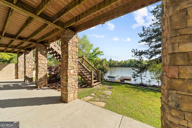 view of patio / terrace with a water view