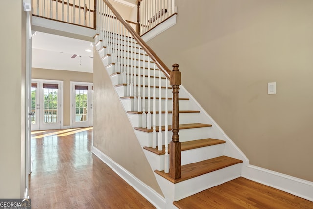 stairway with light wood-type flooring