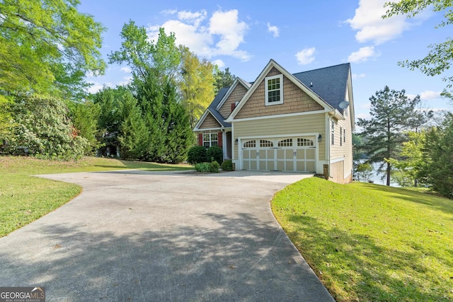 view of front facade featuring a front yard and a garage