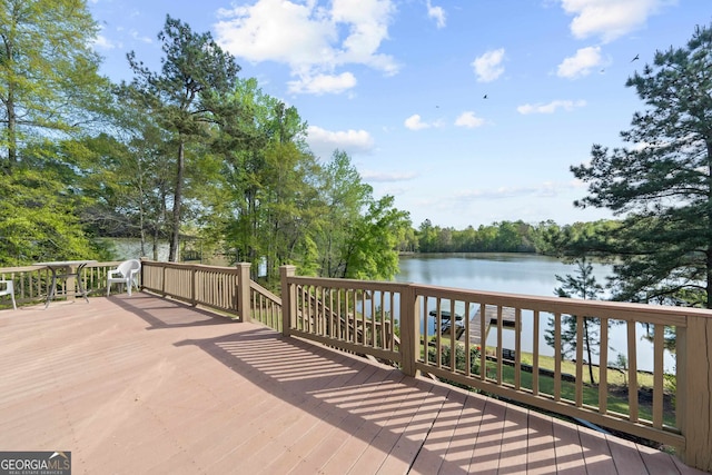 wooden deck featuring a water view