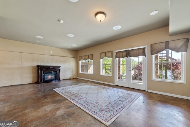 unfurnished living room featuring french doors