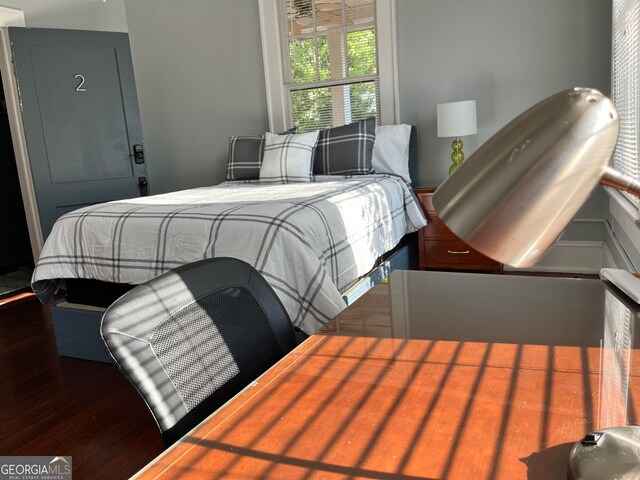 bedroom with wood-type flooring