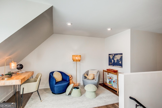 living area with vaulted ceiling