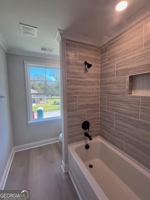 35 Fairwinds Unit 207, Waverly, GA 31565 - bathroom with toilet, baseboards, visible vents, and wood finished floors