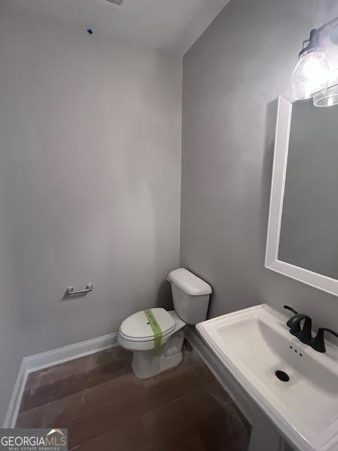 35 Fairwinds Unit 207, Waverly, GA 31565 - bathroom featuring baseboards, a sink, and toilet
