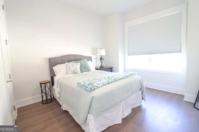 bedroom featuring dark wood-type flooring