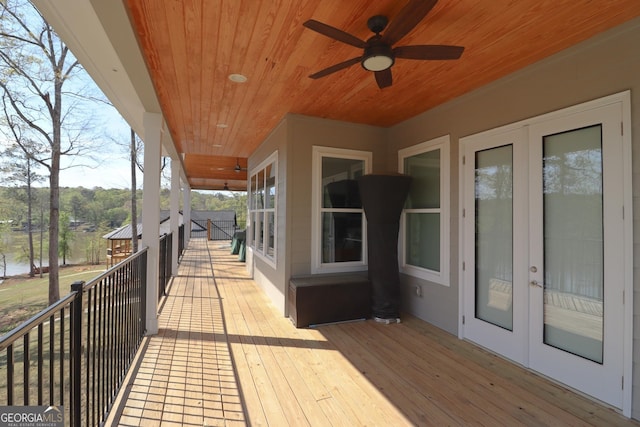 wooden terrace with french doors and ceiling fan