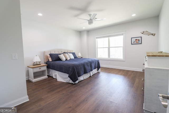 bedroom with ceiling fan and dark hardwood / wood-style floors