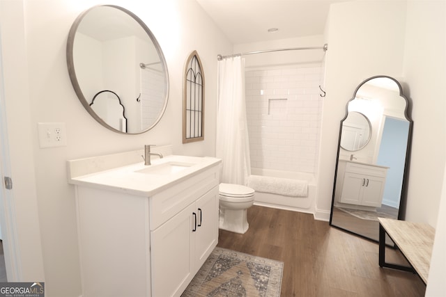 full bathroom with hardwood / wood-style floors, shower / bathtub combination with curtain, toilet, and large vanity