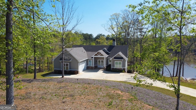 view of front of property featuring a garage and a front lawn