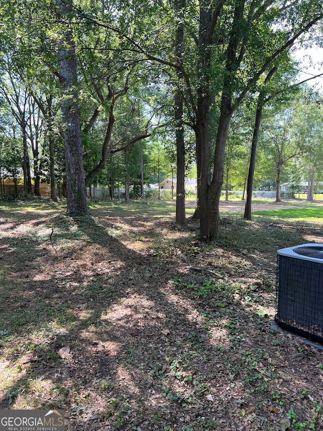 view of yard with central air condition unit