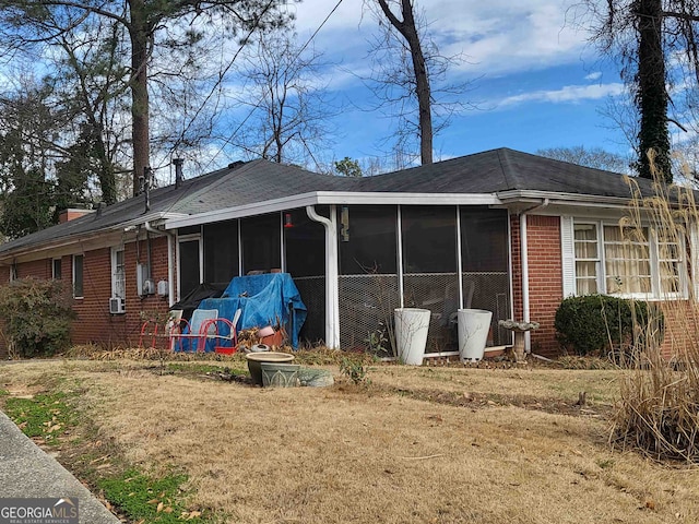 back of property featuring a sunroom