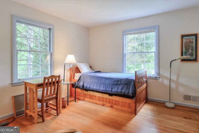 bedroom with light wood-type flooring