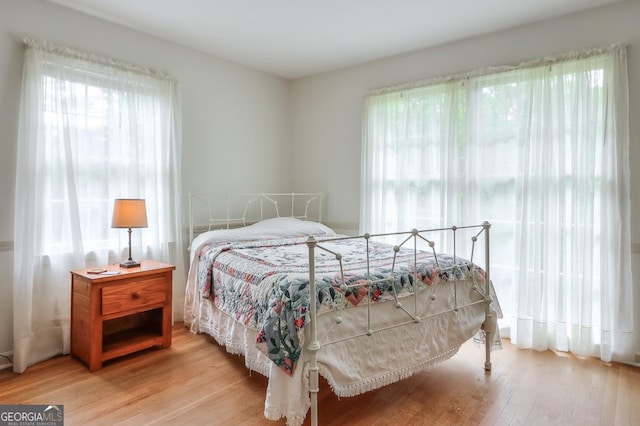 bedroom with light hardwood / wood-style flooring