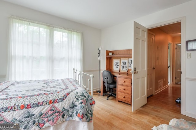 bedroom with light wood-type flooring