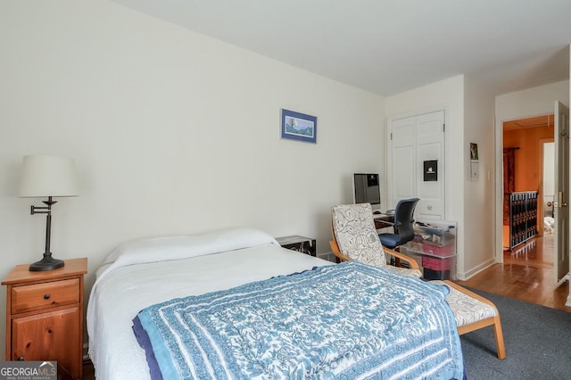 bedroom with hardwood / wood-style floors