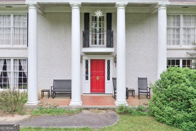 property entrance with a balcony