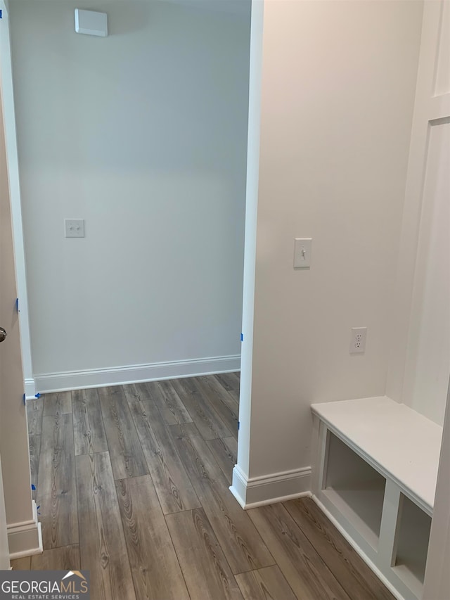 hallway featuring dark hardwood / wood-style flooring