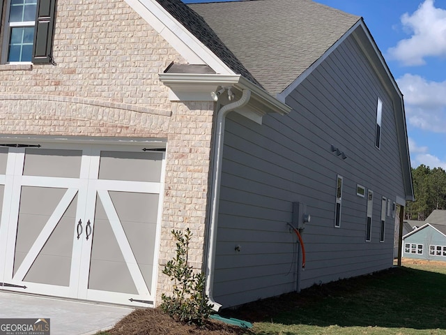 view of property exterior with a garage