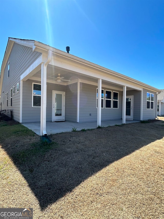 view of front of property with a front yard and a patio area