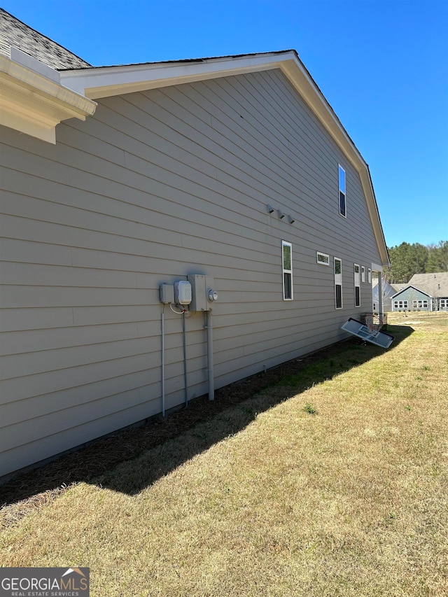 view of home's exterior featuring a lawn