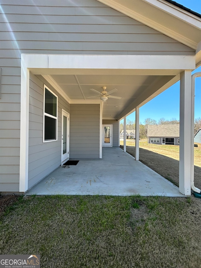 view of patio featuring ceiling fan