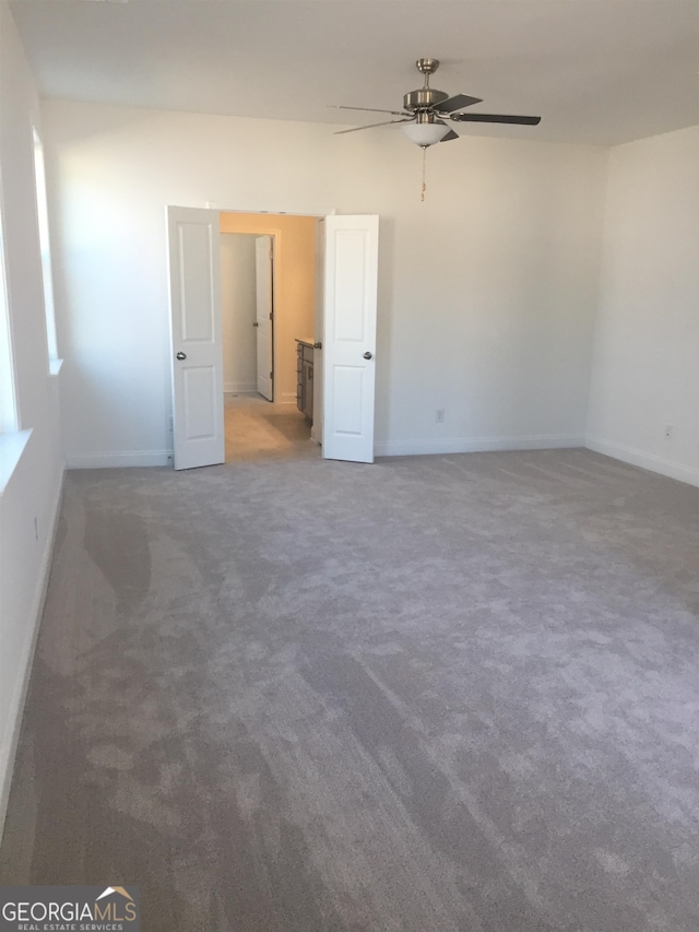 interior space featuring ceiling fan