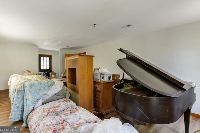 bedroom with wood-type flooring