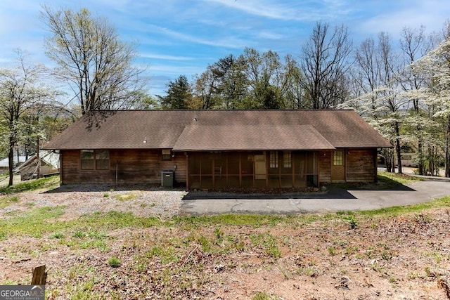 view of side of property with central AC unit