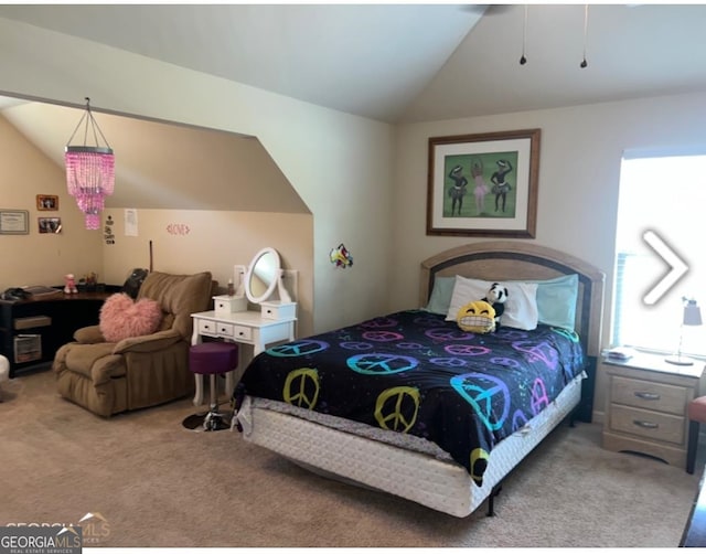 bedroom featuring vaulted ceiling and carpet floors