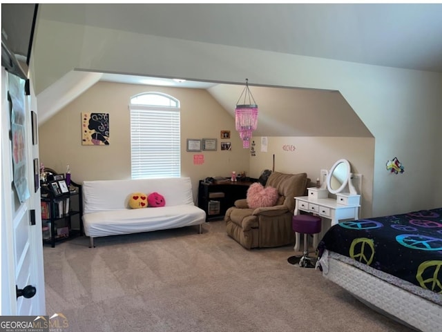 bedroom with light colored carpet and lofted ceiling