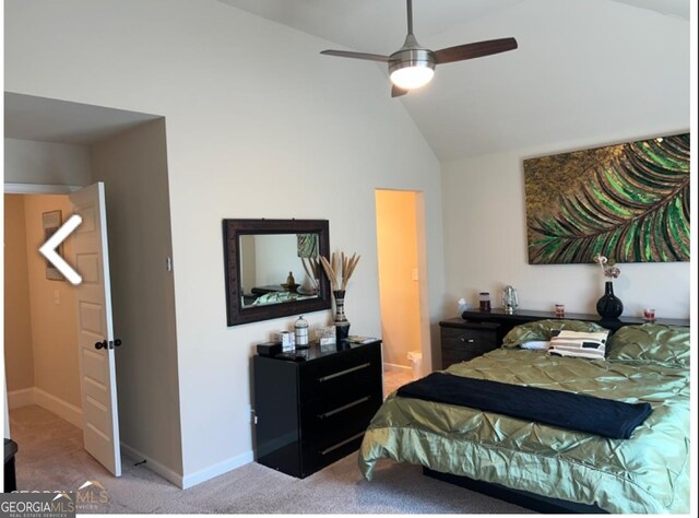 carpeted bedroom with vaulted ceiling and ceiling fan