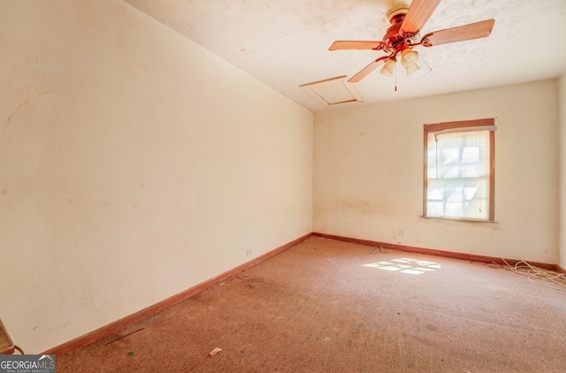 empty room featuring ceiling fan and carpet flooring