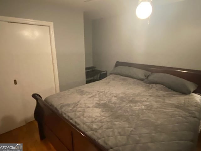 bedroom with wood-type flooring