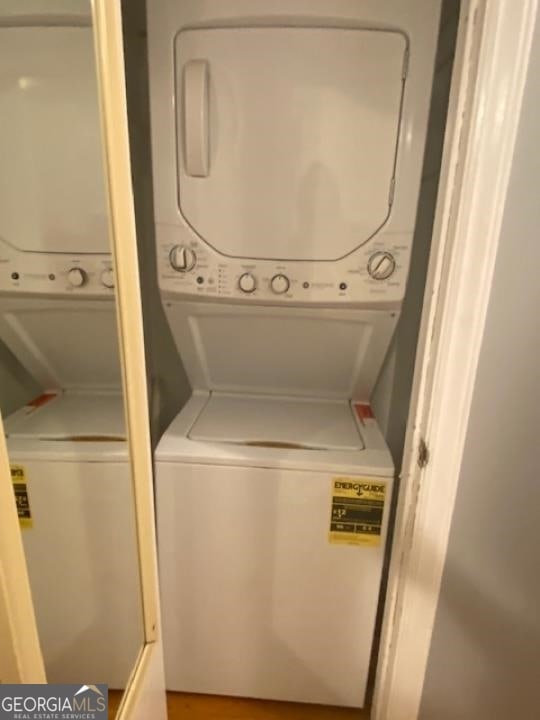 washroom with stacked washer and clothes dryer