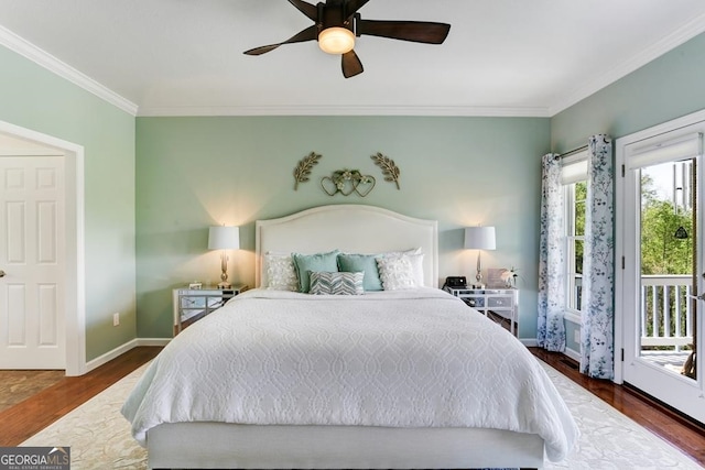 bedroom with dark hardwood / wood-style flooring, ceiling fan, access to exterior, and multiple windows