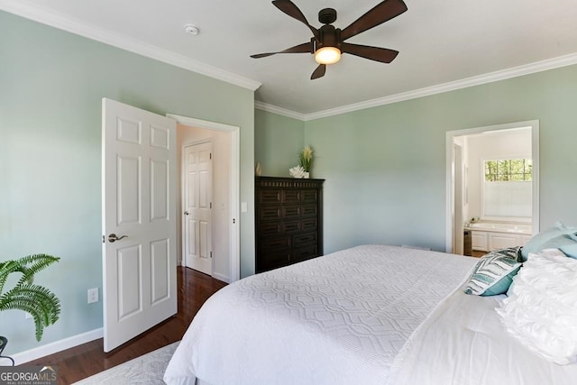 bedroom featuring ensuite bath, ceiling fan, dark hardwood / wood-style flooring, and crown molding