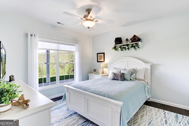 bedroom with ceiling fan and hardwood / wood-style floors