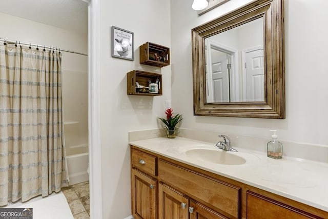 bathroom featuring shower / tub combo with curtain, oversized vanity, and tile floors