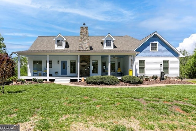 cape cod house featuring a porch and a front lawn