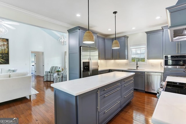 kitchen with a kitchen island, stainless steel appliances, dark hardwood / wood-style floors, tasteful backsplash, and sink