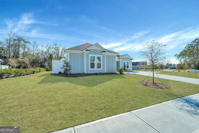 ranch-style house with a front lawn