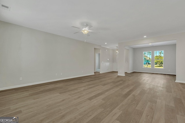 unfurnished living room with ceiling fan and light wood-type flooring