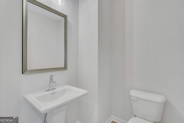 bathroom featuring sink and toilet