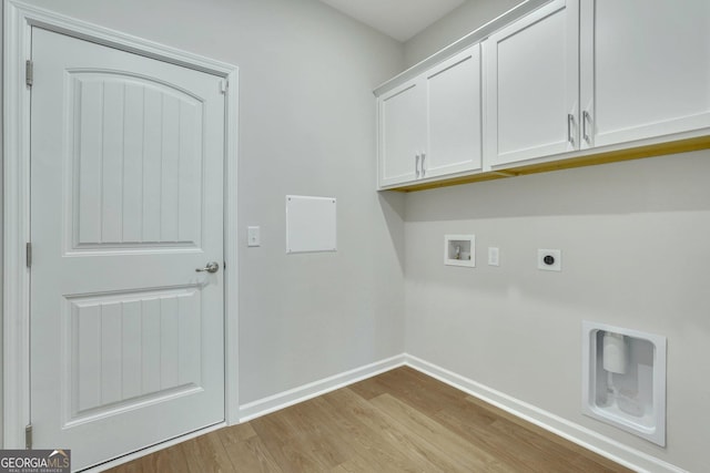 washroom with hookup for a washing machine, light wood-type flooring, cabinets, and hookup for an electric dryer