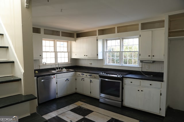 kitchen featuring white cabinets, plenty of natural light, sink, and stainless steel appliances